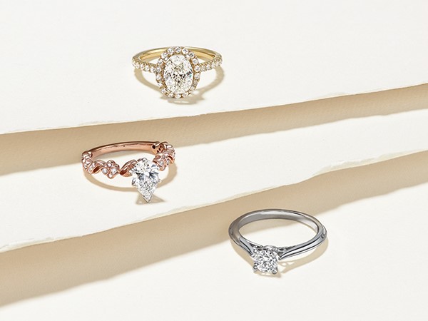 Three engagement rings varying in price.