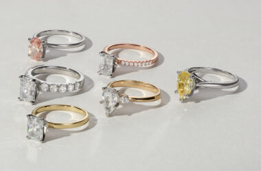 six engagement rings in gold, white gold, platinum, and rose gold. Featuring diamonds, sapphires, and colorful gemstones