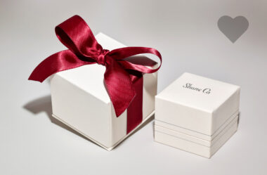 Shane Co. gift box with red ribbon on it